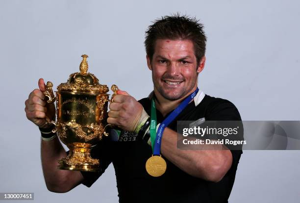 All Black captain Richie McCaw poses with the Webb Ellis Cup following his team's 8-7 victory during the 2011 IRB Rugby World Cup Final match between...