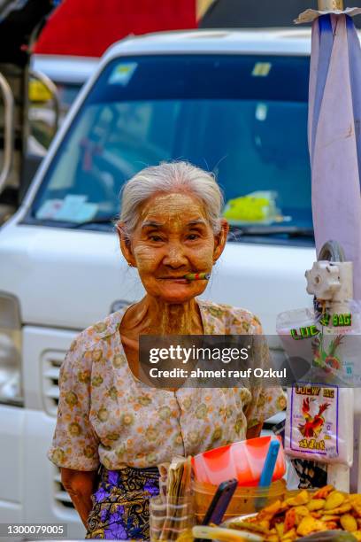 old woman at the counter - myanmar stock pictures, royalty-free photos & images