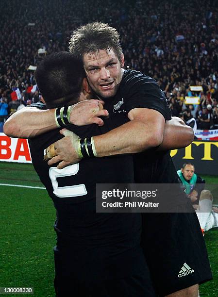 Richie McCaw of the All Blacks celebrates with Keven Mealamu of the All Blacks during the 2011 IRB Rugby World Cup Final match between France and New...