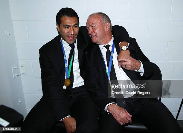 All Black coach Graham Henry celebrates with injured fullback Mils Muliaina following their team's 8-7 victory during the 2011 IRB Rugby World Cup...