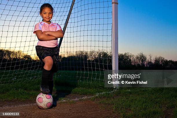 little girl soccer - kids standing crossed arms stock-fotos und bilder