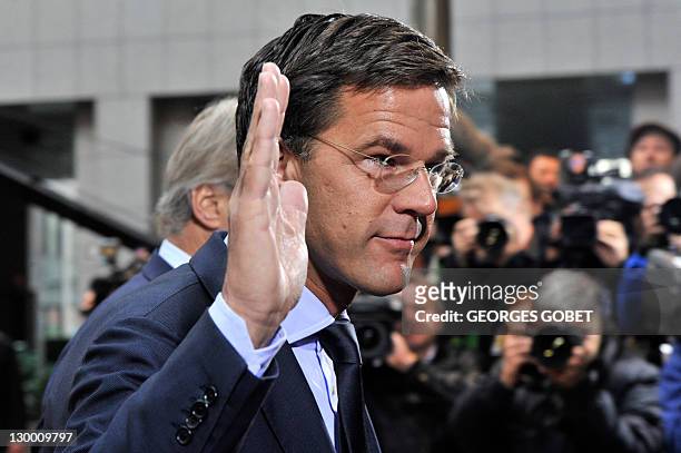Dutch Prime Minister Mark Rutte waves as he arrives prior to an European Council at the Justus Lipsius building, EU headquarters in Brussels on...