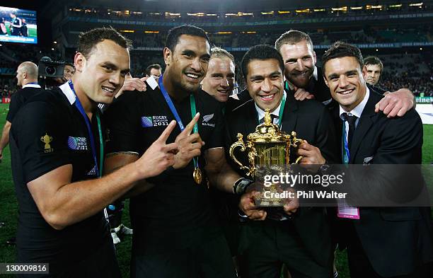 Israel Dagg, Jerome Kaino, Mils Muliaina and Dan Carter of the All Blacks pose with the Webb Ellis Cup after the 2011 IRB Rugby World Cup Final match...