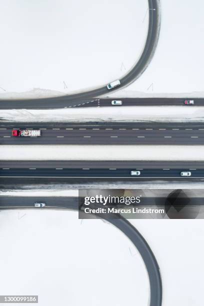 highway and snow in winter - stockholm winter stock pictures, royalty-free photos & images