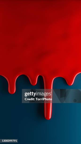 glossy red paint flows over blue background - shiny paint stock pictures, royalty-free photos & images