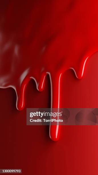 glossy red paint flows over red background - blood flow photos et images de collection