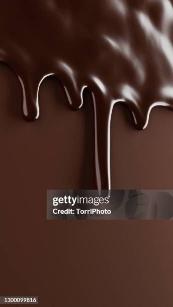 melted chocolate drips over brown background - chocolate foto e immagini stock