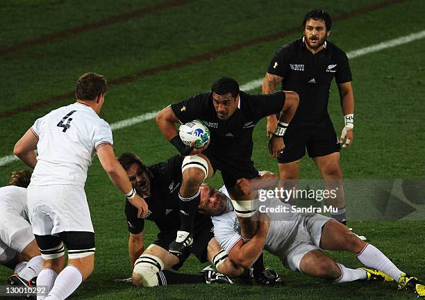 Jerome Kaino of the All Blacks is tackled by William Servat of France during the 2011 IRB Rugby World Cup Final match between France and New Zealand...