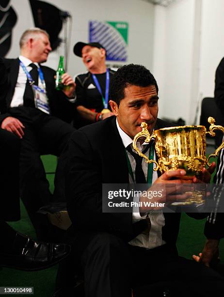 Mils Muliaina of the All Blacks drinks out of the Webb Ellis Cup after the 2011 IRB Rugby World Cup Final match between France and New Zealand at...