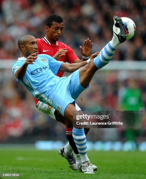 Gael Clichy of Manchester City competes with Nani of Manchester United during the Barclays Premier League match between Manchester United and...