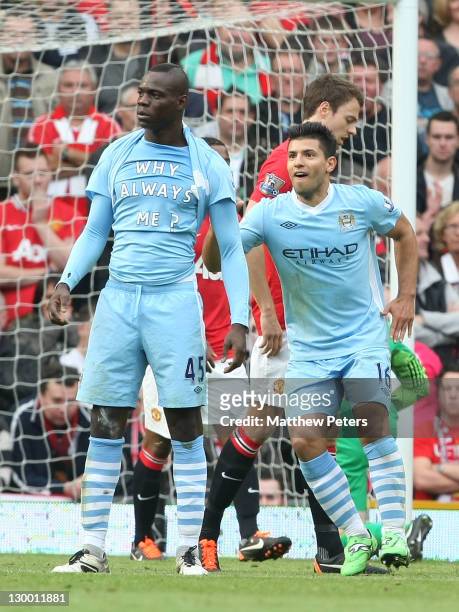 Mario Balotelli of Manchester City celebrates scoring their first goal during the Barclays Premier League match between Manchester United and...