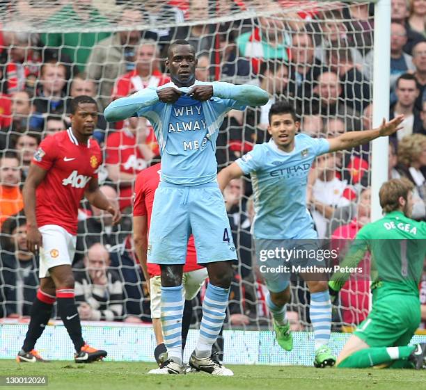 Mario Balotelli of Manchester City celebrates scoring their first goal during the Barclays Premier League match between Manchester United and...