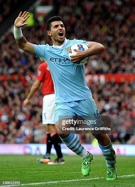 Sergio Aguero of Manchester City celebrates scoring his team's third goal during the Barclays Premier League match between Manchester United and...
