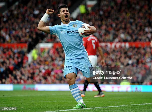 Sergio Aguero of Manchester City celebrates scoring his team's third goal during the Barclays Premier League match between Manchester United and...