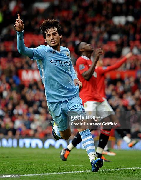 David Silva of Manchester City celebrates scoring his team's fifth goal during the Barclays Premier League match between Manchester United and...