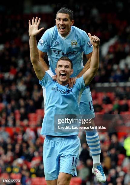Edin Dzeko of Manchester City celebrates scoring his team's sixth goal with team mate Aleksandar Kolarov during the Barclays Premier League match...