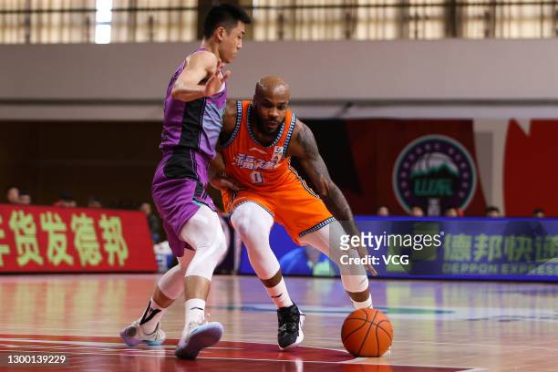 Robert Wilson 'Trae' Golden of Fujian Sturgeons drives the ball during 2020/2021 Chinese Basketball Association League match between Shandong Heroes...
