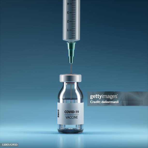 syringe and bottle on blue background - injecting stock pictures, royalty-free photos & images