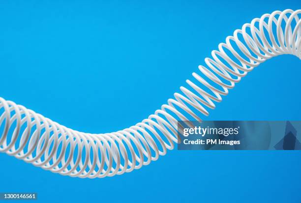 abstract white coil - metal coil toy stockfoto's en -beelden