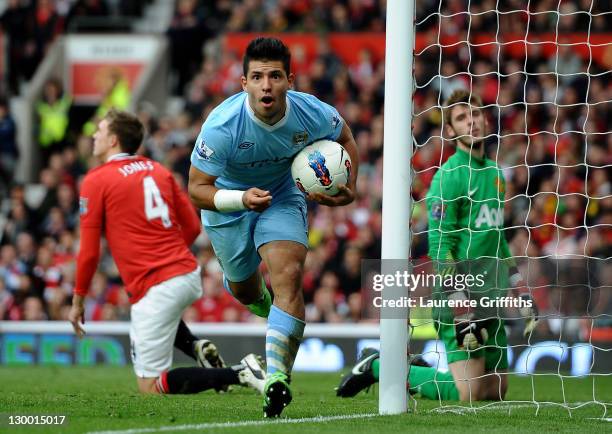 Sergio Aguero of Manchester City celebrates scoring his team's third goal during the Barclays Premier League match between Manchester United and...
