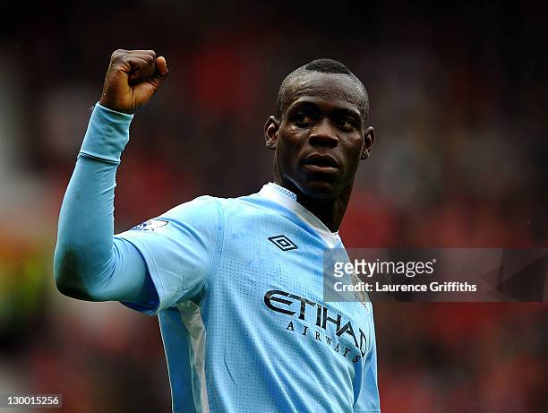Mario Balotelli of Manchester City celebrates scoring his team's second goal during the Barclays Premier League match between Manchester United and...