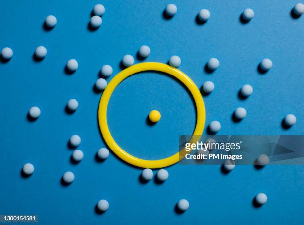 one ball in ring, many excluded - exclusion concept stock pictures, royalty-free photos & images