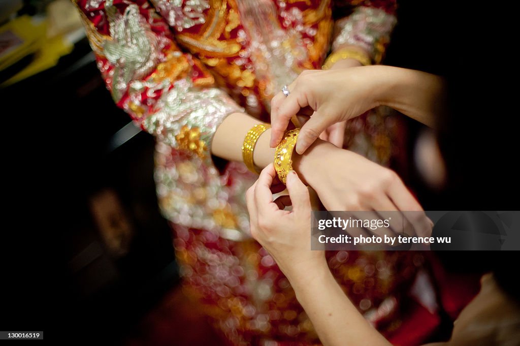 Chinese woman wearing gold jewellery