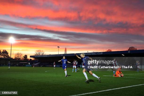 Pernille Harder of Chelsea celebrates after scoring her team's first goal as the sun sets around the stadium during the FA Women's Continental League...