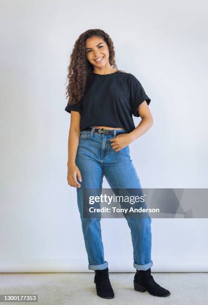 portrait of young woman on white background - black woman happy white background foto e immagini stock