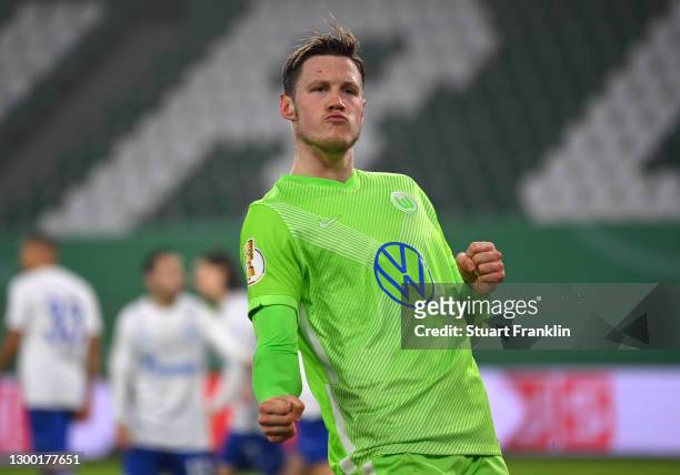 Wout Weghorst of VfL Wolfsburg celebrates after scoring their side's first goal during the DFB Cup Round of Sixteen match between VfL Wolfsburg and...