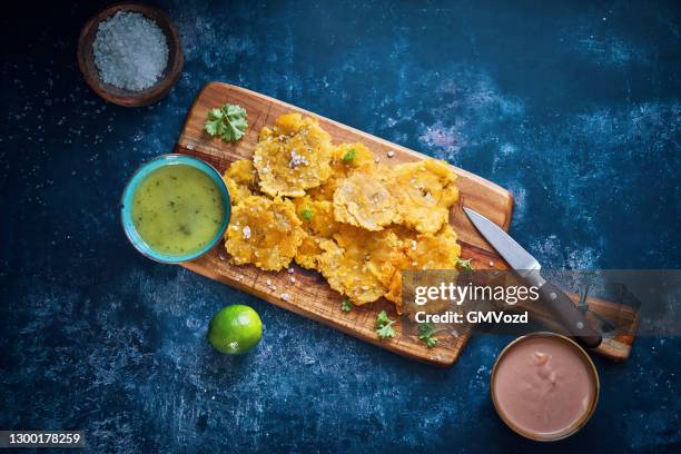 tostones puerto rican fried plantains - plantain stock pictures, royalty-free photos & images