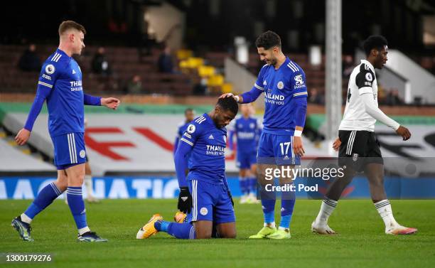 Kelechi Iheanacho of Leicester City is congratulated by team mates Harvey Barnes and Ayoze Perez after scoring their side's first goal as Ola Aina of...