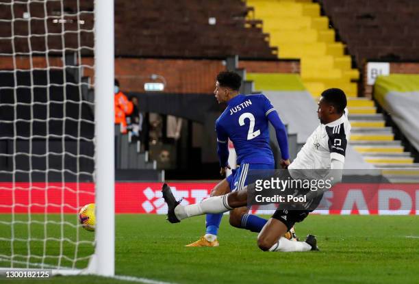 James Justin of Leicester City scores their side's second goal whilst under pressure from Tosin Adarabioyo of Fulham during the Premier League match...