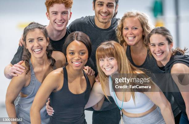 multi ethnic group of athletic adults - ymca stock pictures, royalty-free photos & images