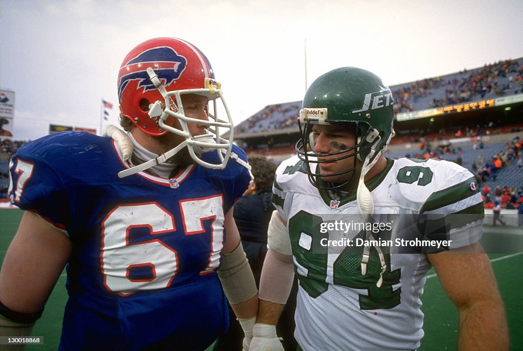 Scott Mersereau New York Jets Scott Mersereau and Buffalo Bills Kent Hull on field ...