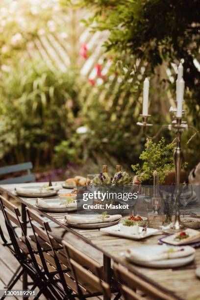 food arranged on table for social event - dinner on the deck stock pictures, royalty-free photos & images