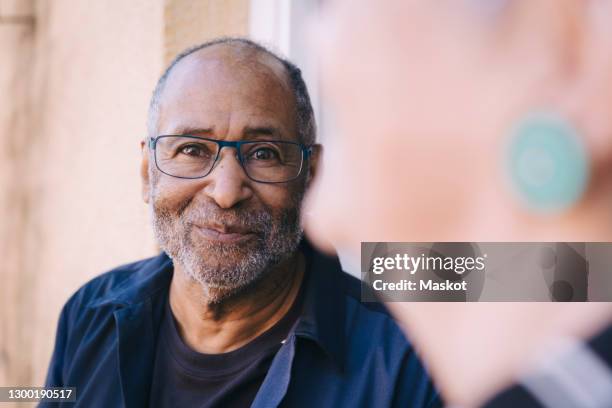 smiling senior man in balcony - scandinavian ethnicity 個照片及圖片檔