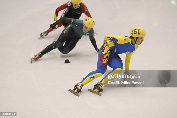 Dong-Sung Kim of Korea and Steven Bradbury of Australia compete in the men's 1500m speed skating final during the Salt Lake City Winter Olympic Games...