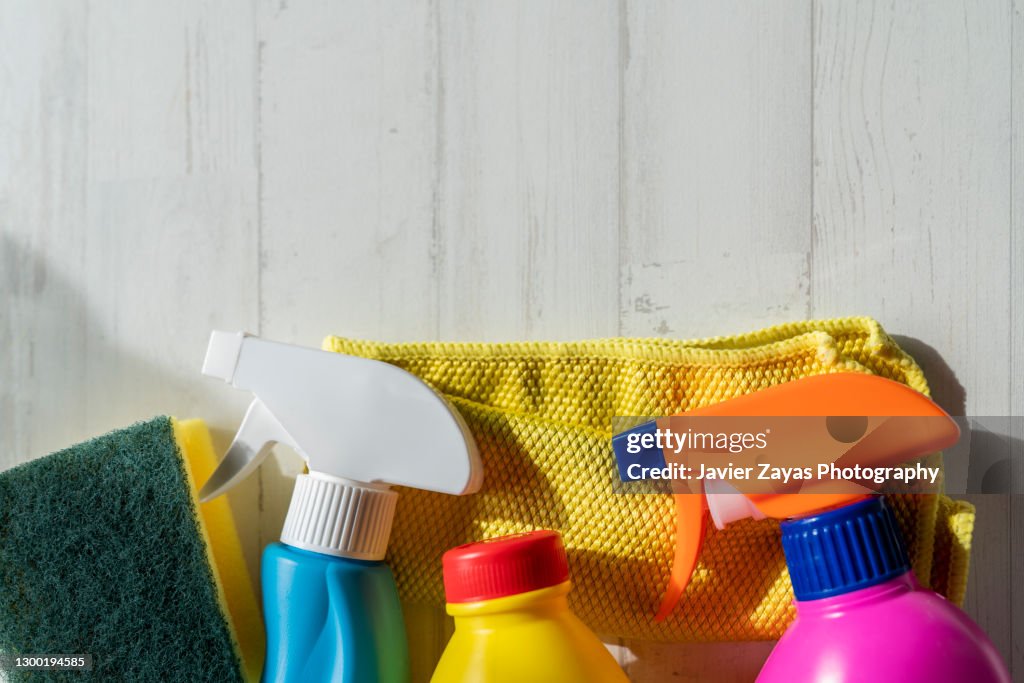 Some Cleaning Supplies On Wooden Table