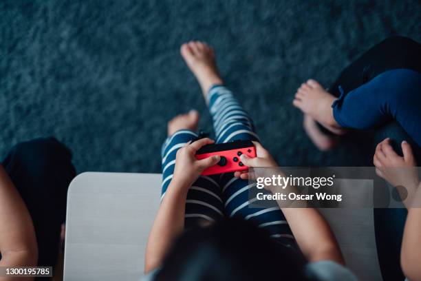 family playing video games. family bonding activities. - brand name video game foto e immagini stock