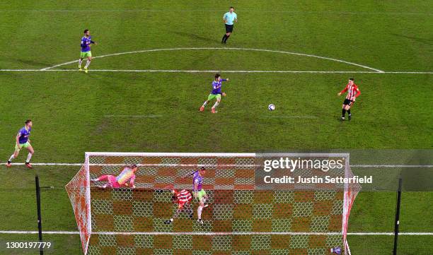 Sergi Canos of Brentford scores their side's first goal past Daniel Bentley of Bristol City during the Sky Bet Championship match between Brentford...