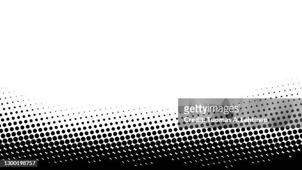 black abstract dotted halftone background with copy space. - chiazzato foto e immagini stock