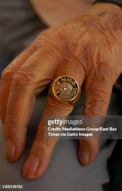 Former Golden State Warriors owner Franklin Mieuli shows his 1975 NBA World Championship ring at his Berkeley, California home on March 25, 2008.