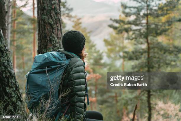 woman hiking in the forest - androgynous stock pictures, royalty-free photos & images