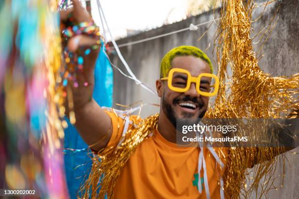 man with hair painting dancing carnival - block party stock pictures, royalty-free photos & images