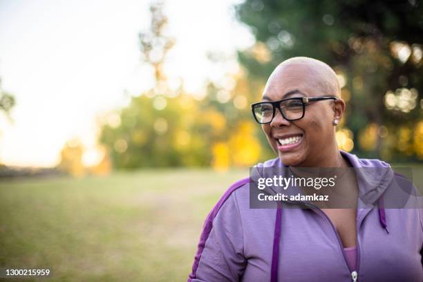 portrait of a beautiful black woman dancing. - active lifestyle overweight stock pictures, royalty-free photos & images