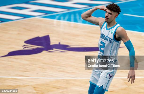 LaMelo Ball of the Charlotte Hornets reacts following a three point basket during the first quarter of their game against the Philadelphia 76ers at...