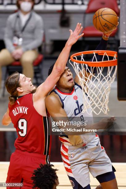 Rui Hachimura of the Washington Wizards is fouled on a layup by Kelly Olynyk of the Miami Heat during the first quarter at American Airlines Arena on...
