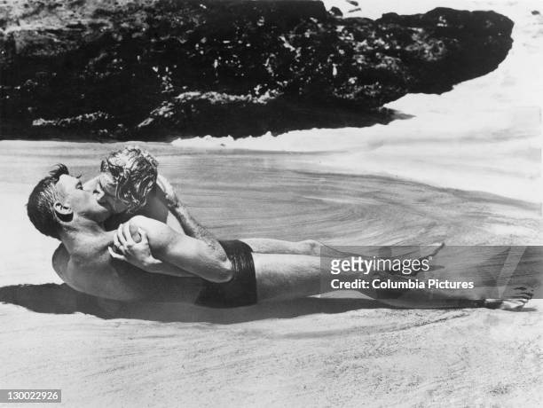 Burt Lancaster and Deborah Kerr in a scene from 'From Here to Eternity', Halona Cove, Oahu, Hawaii, 1953. The film was directed by Fred Zinnemann,...