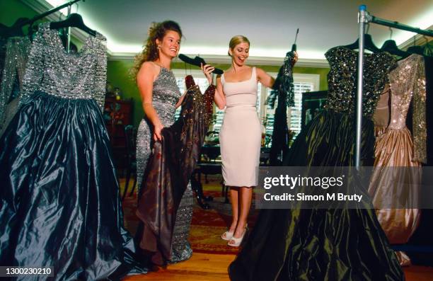 Tabitha Furyk, wife of Jim Furyk and Julie Crenshaw, wife of Ben Crenshaw of the USA choosing evening gowns for one of the large parties before the...